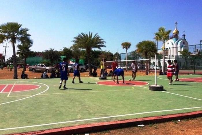 Baan Dusit Pattaya Park aerial view of a single-story house with a grey tiled roof, covered patio, and lush garden.