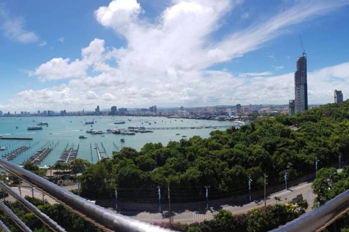 Royal Cliff Garden large outdoor pool with blue water and surrounding greenery, overlooking the ocean.