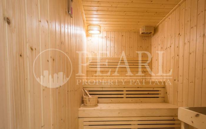 The Orient Resort & Spa: Interior of a wooden sauna room with tiered benches and a bucket.