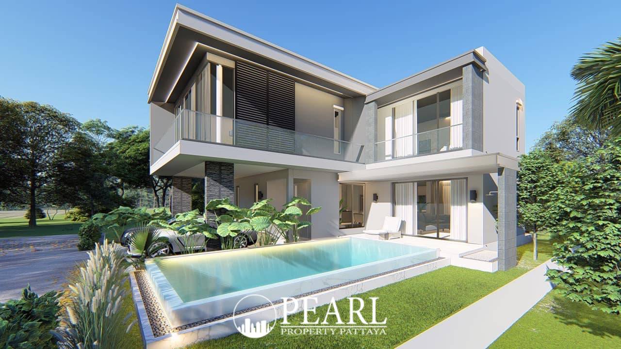 Luxury Vista Villas front view of a modern villa with a two-car garage and tropical plants.