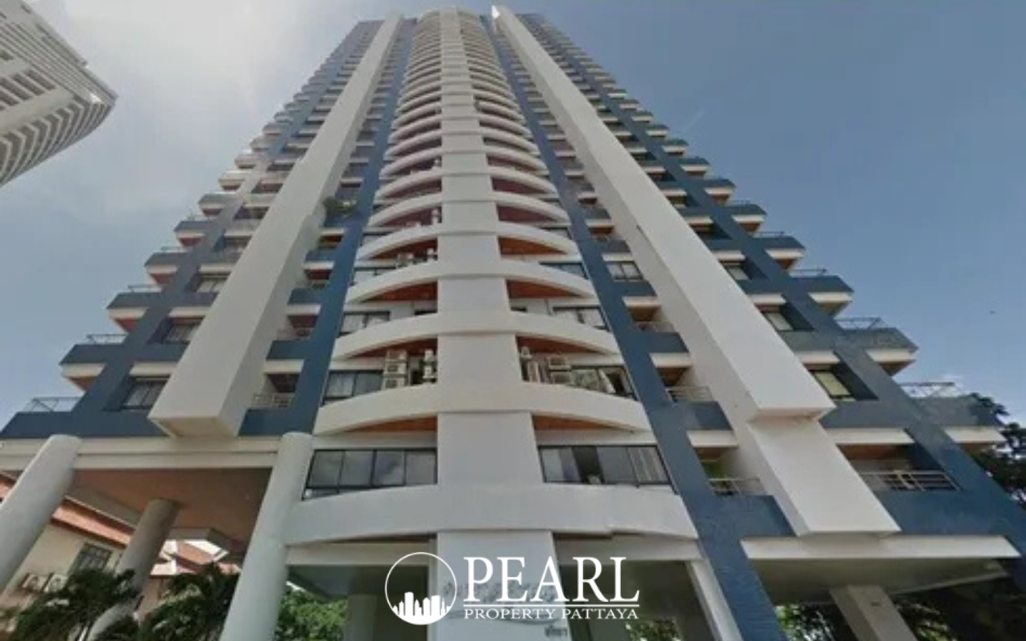 Baan Haad Uthong Condominium panoramic ocean view from a balcony with sandy beach and palm trees.
