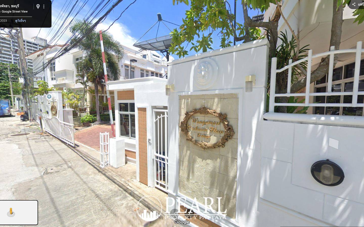 Wongamat Exclusive Place entrance gate with security booth and ornate sign for the property.