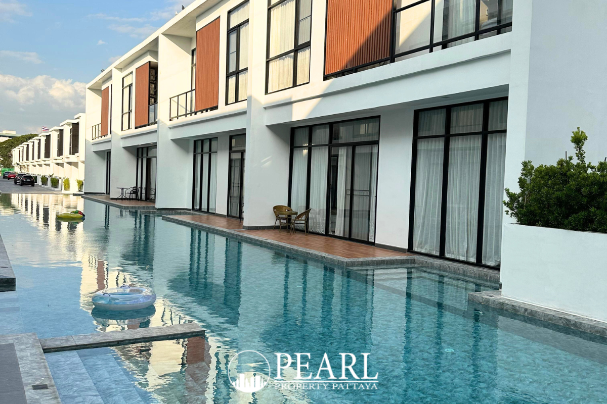 The Rich Garden modern townhouses with private plunge pools, wooden decks, and outdoor seating areas.