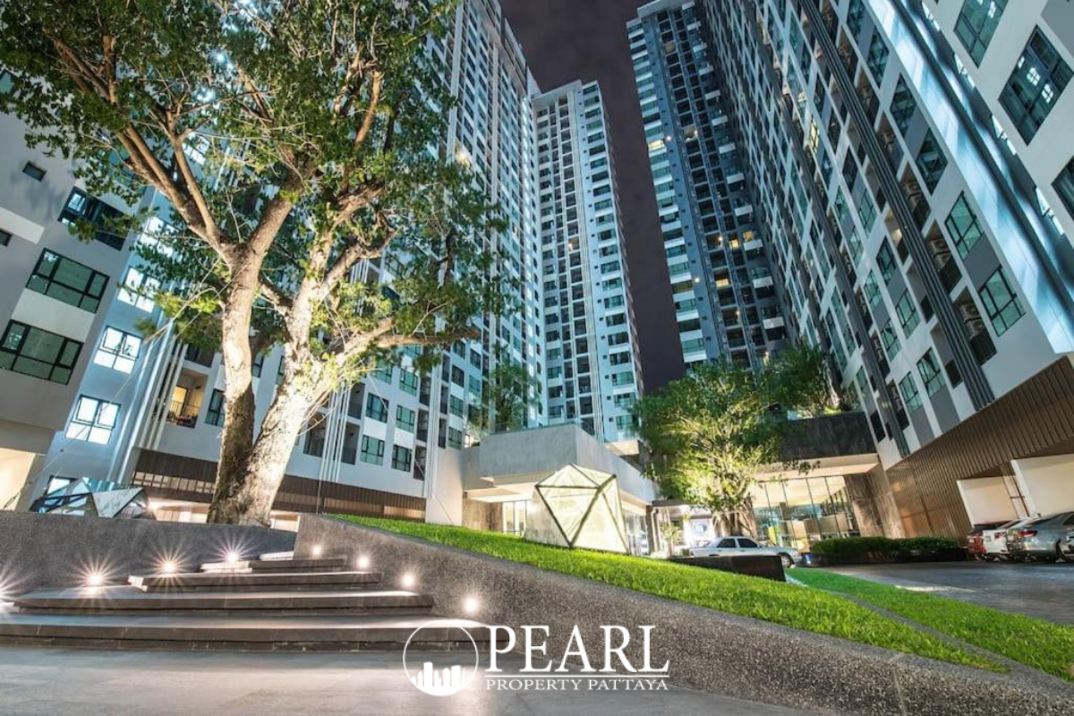The Base Central Pattaya exterior view with modern buildings and prominent signage during the day.